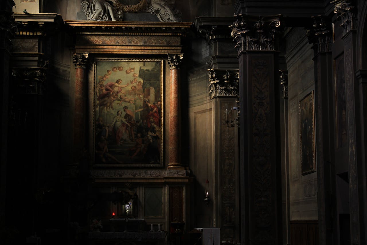 Baroque church interior in Bologna, Italy, featuring classic art and columns.